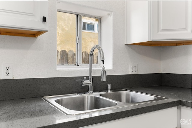914 P St, Bakersfield, CA 93304 - kitchen view of white cabinetry and dark countertops