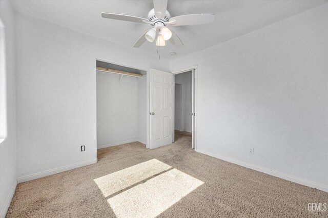 914 P St, Bakersfield, CA 93304 - unfurnished bedroom featuring carpet floors, a closet, and a ceiling fan
