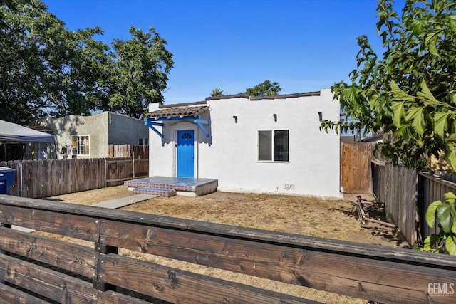 914 P St, Bakersfield, CA 93304 - mediterranean / spanish-style house featuring stucco siding and a fenced backyard