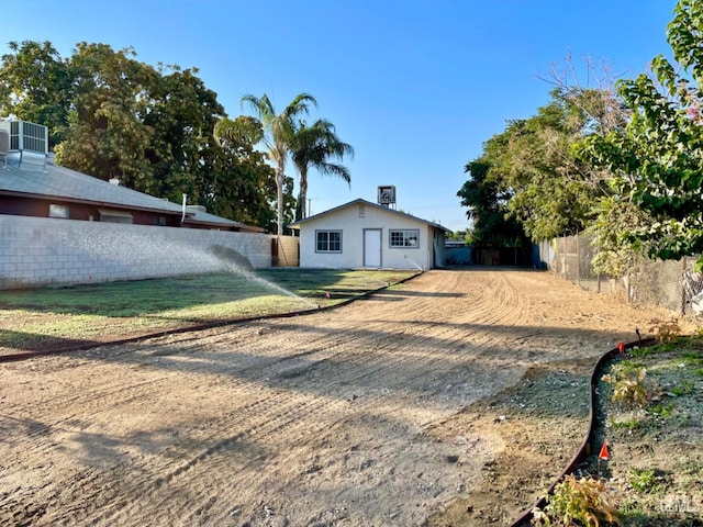8204 Gail Marie Dr, Lamont, CA 93241 - back of house with central AC