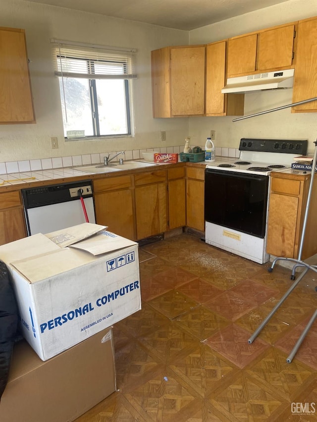 kitchen featuring sink and white appliances