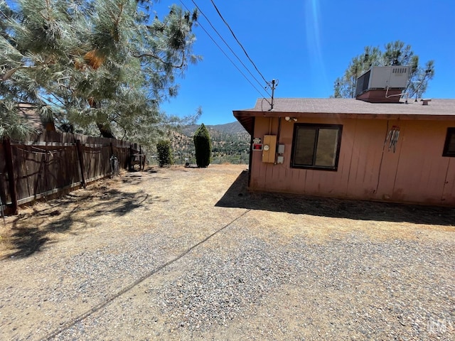 103 Mardella Dr, Wofford Heights, CA 93285 - view of home's exterior featuring central air condition unit and fence