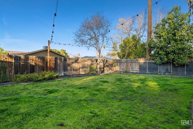 view of yard with a fenced backyard