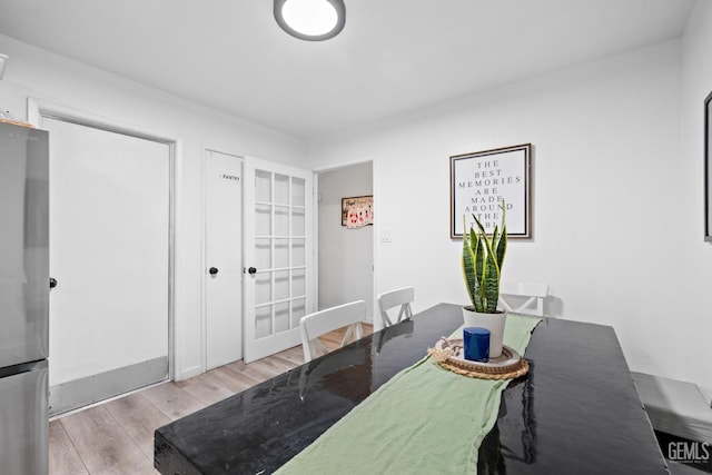 dining area with wood finished floors