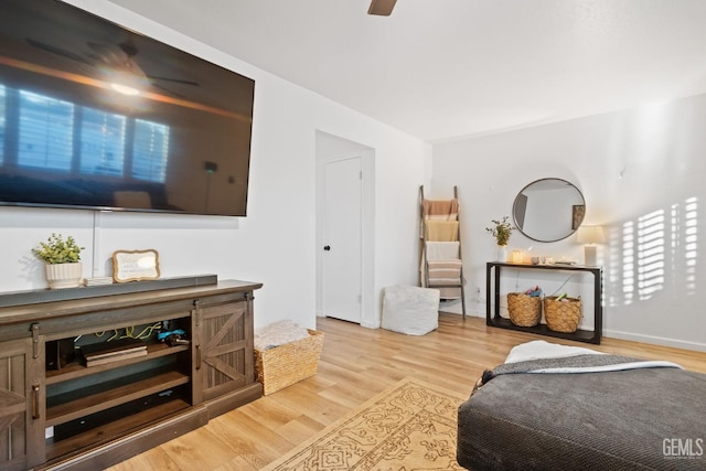 bedroom featuring light wood-style flooring and a ceiling fan