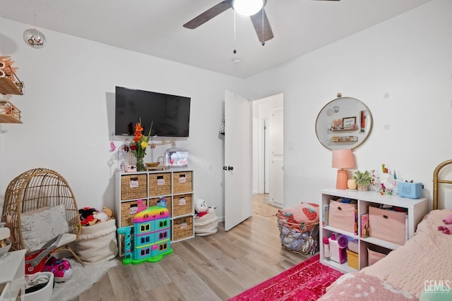 playroom featuring a ceiling fan and wood finished floors