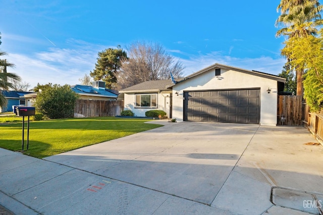 ranch-style home with an attached garage, fence, driveway, stucco siding, and a front yard