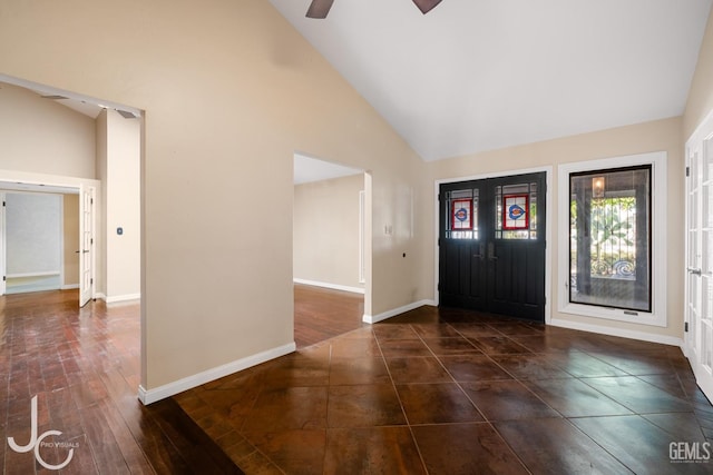 foyer with high vaulted ceiling, a ceiling fan, baseboards, and dark wood-style floors