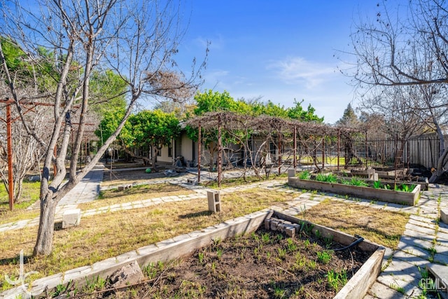 view of yard featuring a garden and fence