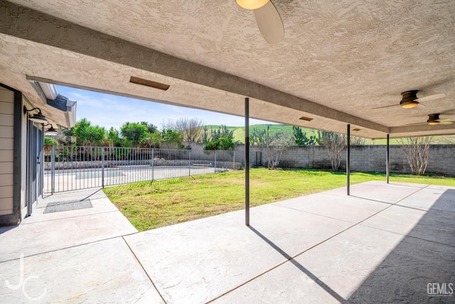 view of patio featuring a fenced backyard, ceiling fan, and a fenced in pool