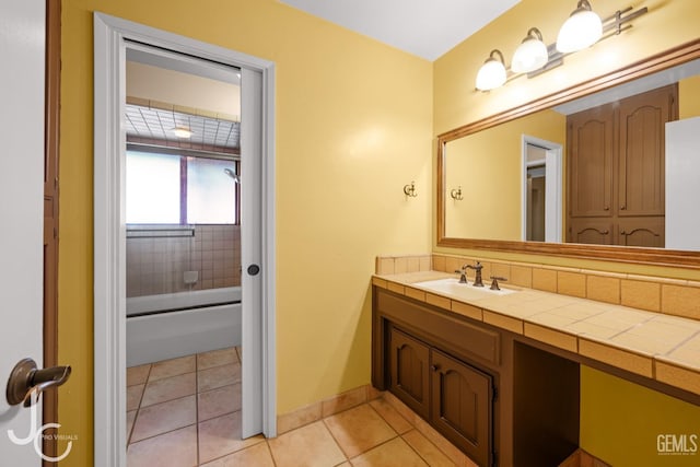 bathroom with tile patterned flooring, vanity, and baseboards