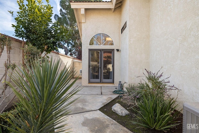 property entrance with a patio area