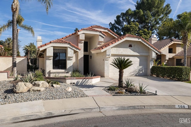 mediterranean / spanish-style house featuring a garage