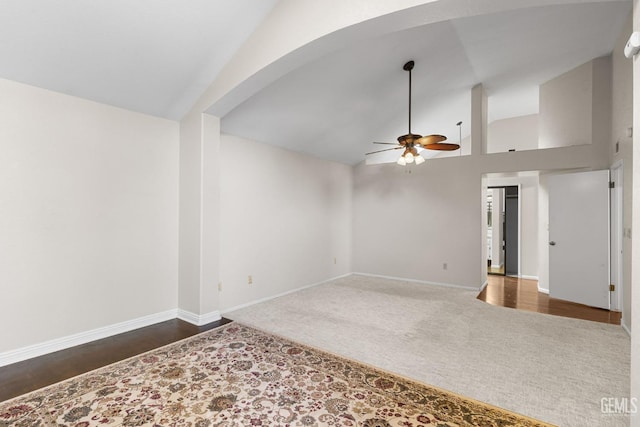 empty room featuring vaulted ceiling and ceiling fan