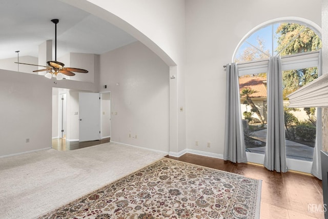 foyer featuring high vaulted ceiling and ceiling fan