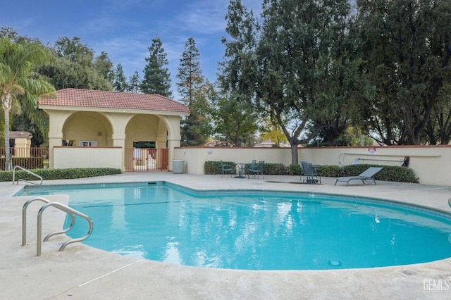 view of pool with a patio area