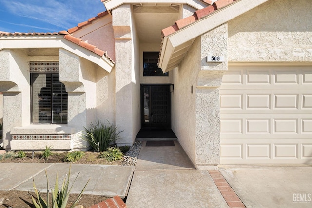 property entrance with a garage