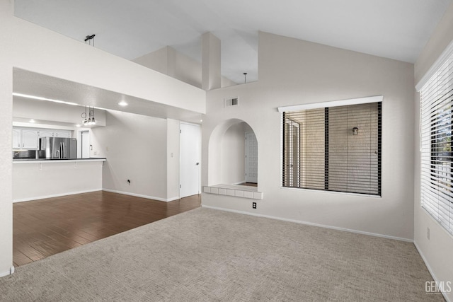 unfurnished living room with dark hardwood / wood-style flooring