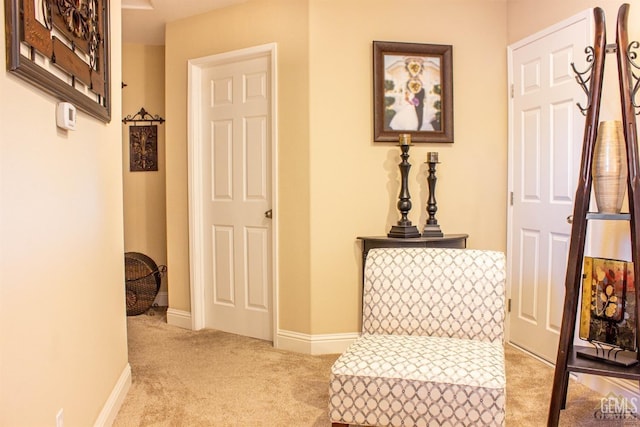 hall with light colored carpet