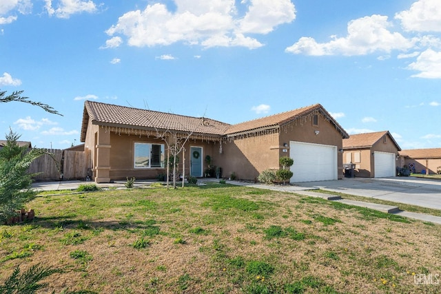 ranch-style house featuring a garage, concrete driveway, a front lawn, and stucco siding