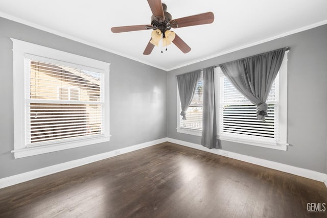 empty room featuring dark hardwood / wood-style floors, ceiling fan, and ornamental molding