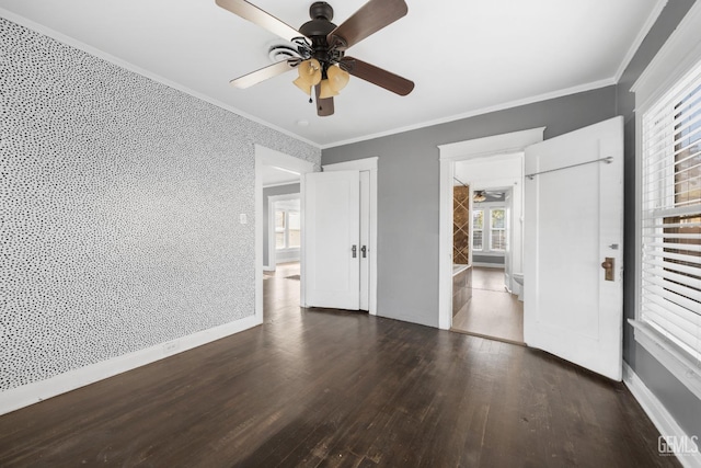 unfurnished bedroom featuring ceiling fan, dark hardwood / wood-style flooring, and crown molding