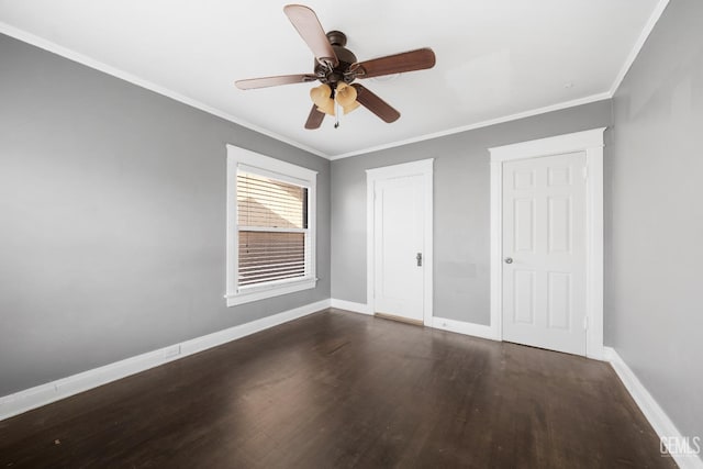 unfurnished bedroom featuring ceiling fan, dark wood-type flooring, and ornamental molding