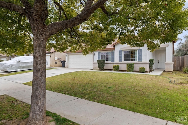 view of front of property with a garage and a front yard