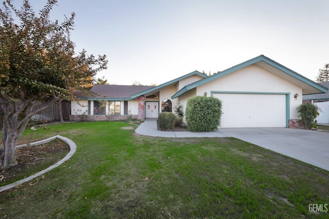 ranch-style home with a garage and a front yard