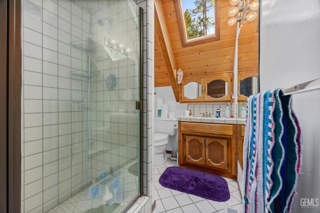 full bath with tile patterned floors, a shower stall, toilet, vanity, and lofted ceiling with skylight