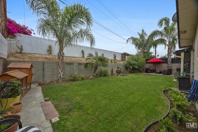 view of yard with a fenced backyard
