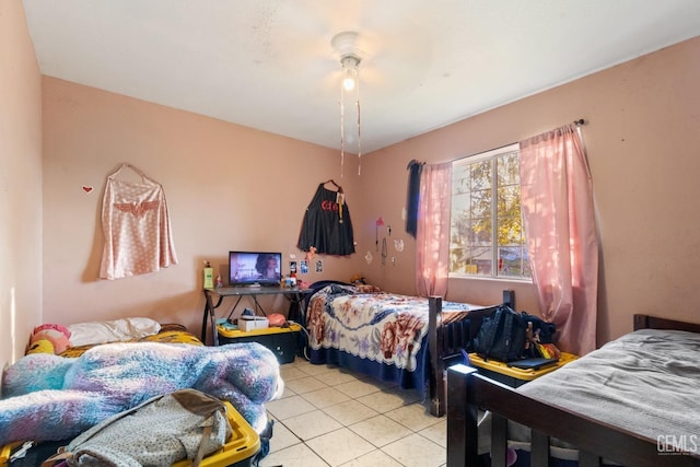 bedroom with light tile patterned flooring and ceiling fan