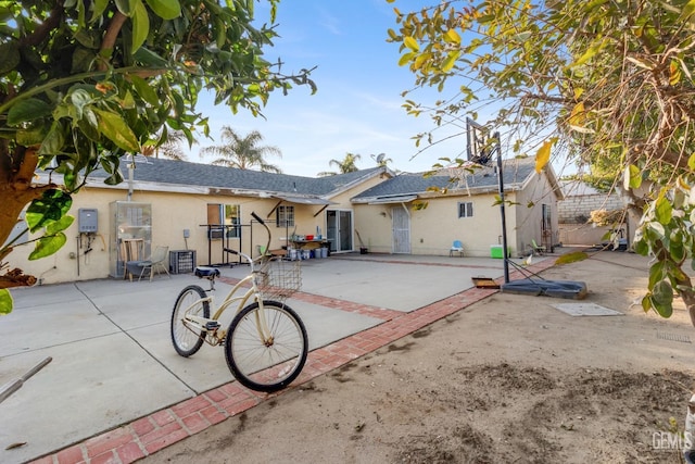 back of house with a patio area