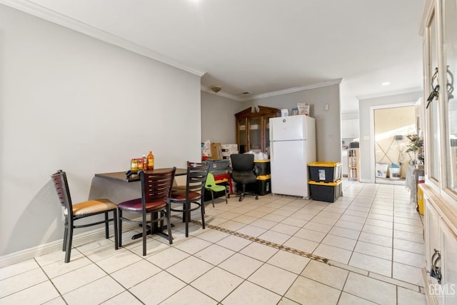 dining room featuring ornamental molding and light tile patterned flooring