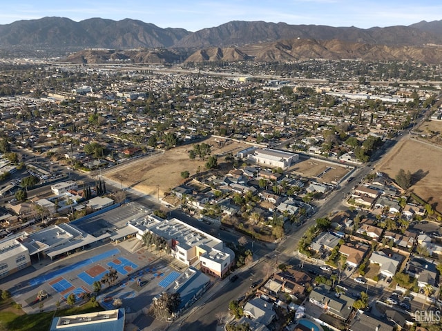 birds eye view of property featuring a mountain view