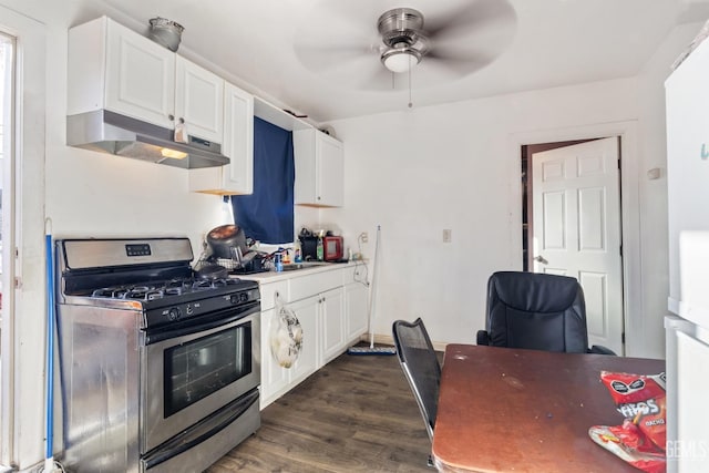 kitchen featuring white cabinetry, sink, dark hardwood / wood-style flooring, ceiling fan, and stainless steel range with gas stovetop