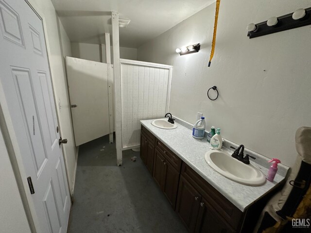 1403 Shasta St, Bakersfield, CA 93308 - full bathroom featuring double vanity, a shower, and concrete flooring