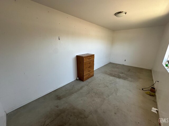 1403 Shasta St, Bakersfield, CA 93308 - empty room with unfinished concrete flooring
