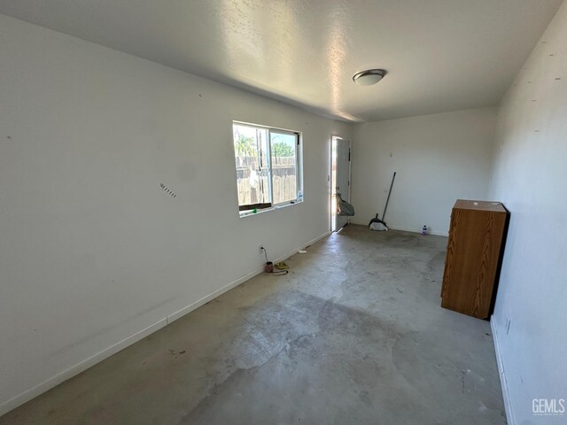 1403 Shasta St, Bakersfield, CA 93308 - empty room with concrete flooring and baseboards