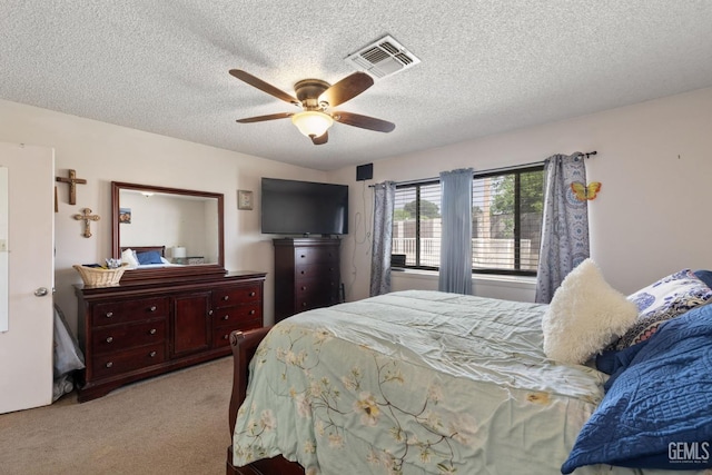 3406 Elm St, Bakersfield, CA 93301 - bedroom with a textured ceiling, carpet, visible vents, and a ceiling fan
