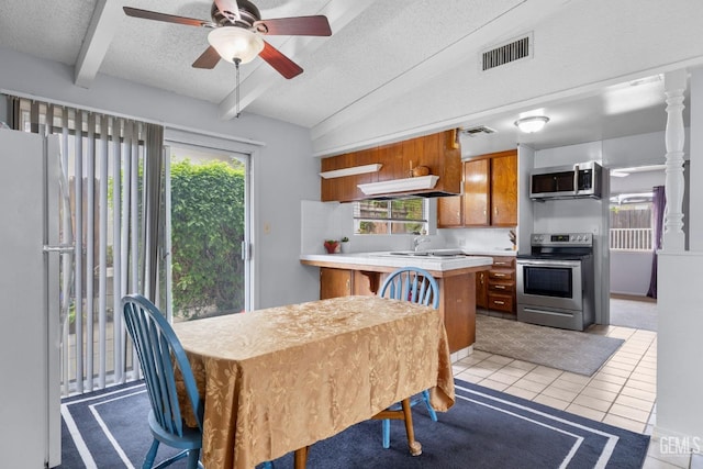 3406 Elm St, Bakersfield, CA 93301 - dining room featuring a ceiling fan, light tile patterned flooring, a textured ceiling, and visible vents