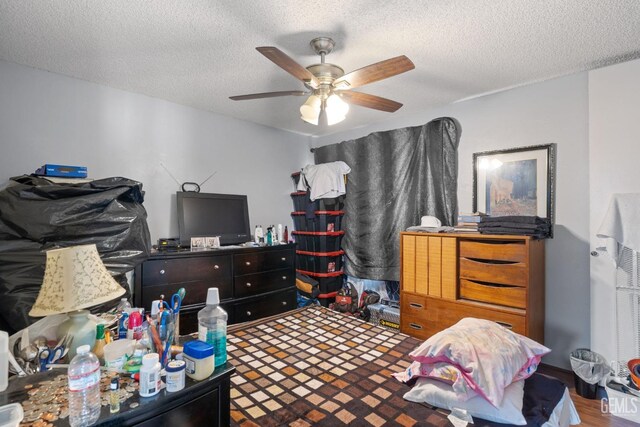 3406 Elm St, Bakersfield, CA 93301 - bedroom with wood finished floors, a textured ceiling, and a ceiling fan