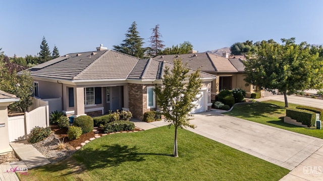 ranch-style home featuring a front yard and a garage