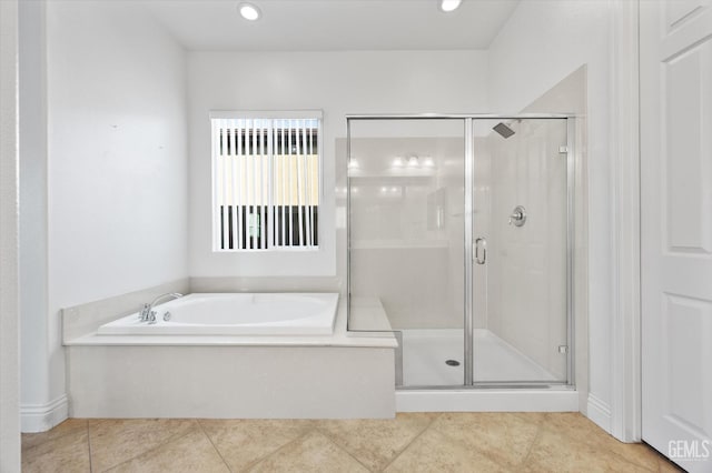 bathroom featuring separate shower and tub and tile patterned flooring