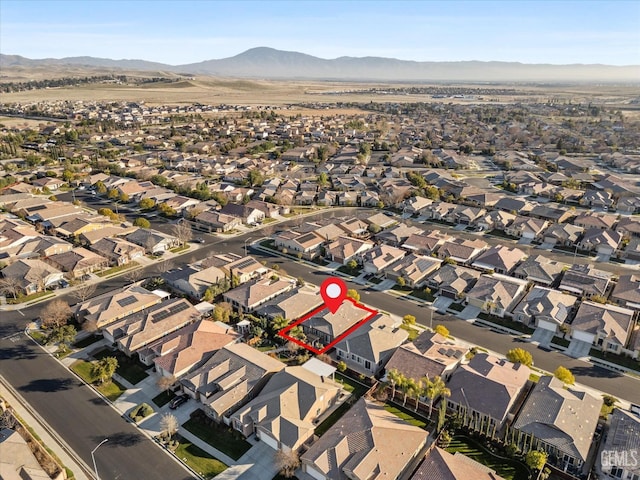 birds eye view of property with a mountain view