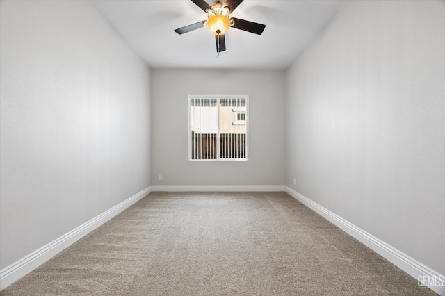 empty room featuring ceiling fan and carpet flooring