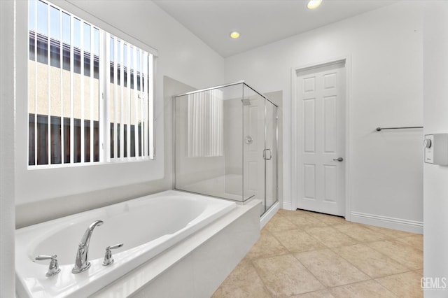 bathroom featuring tile patterned floors and shower with separate bathtub