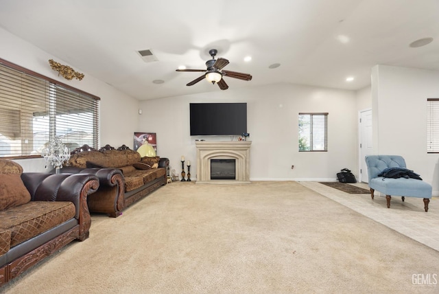 living room featuring light carpet, lofted ceiling, and ceiling fan