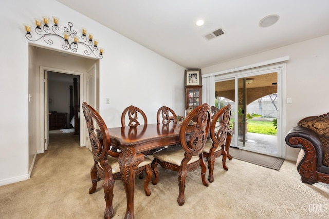 dining room with light carpet