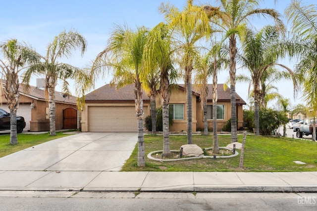 view of front of home with a front lawn and a garage